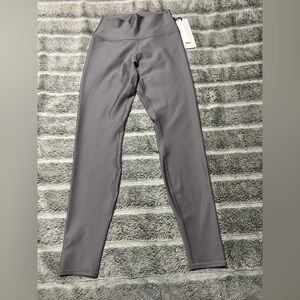 Alo Yoga High-Waist Airlift Leggings in a grey color. Size Medium